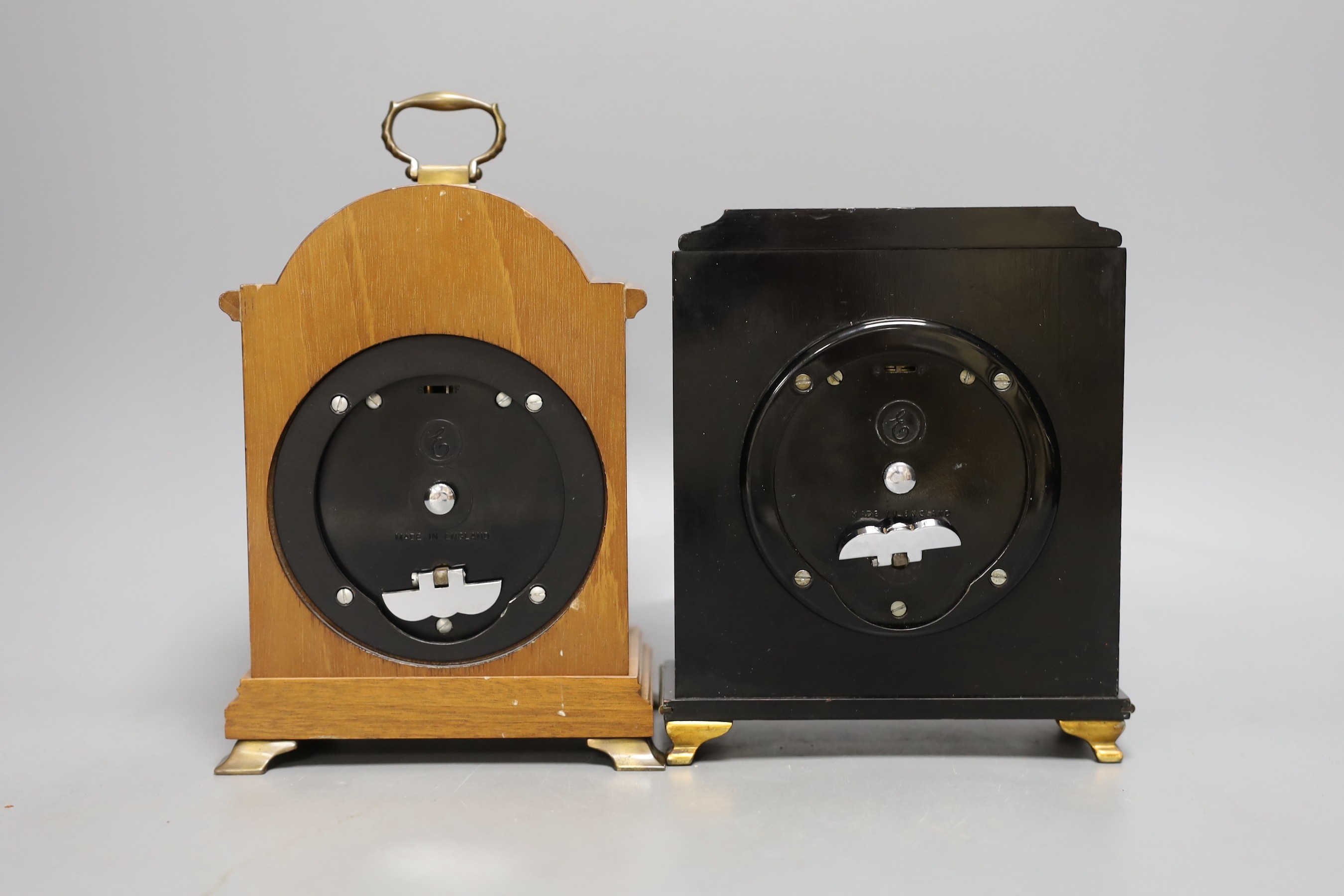 Two Elliott mantel clocks, one walnut and one lacquered.